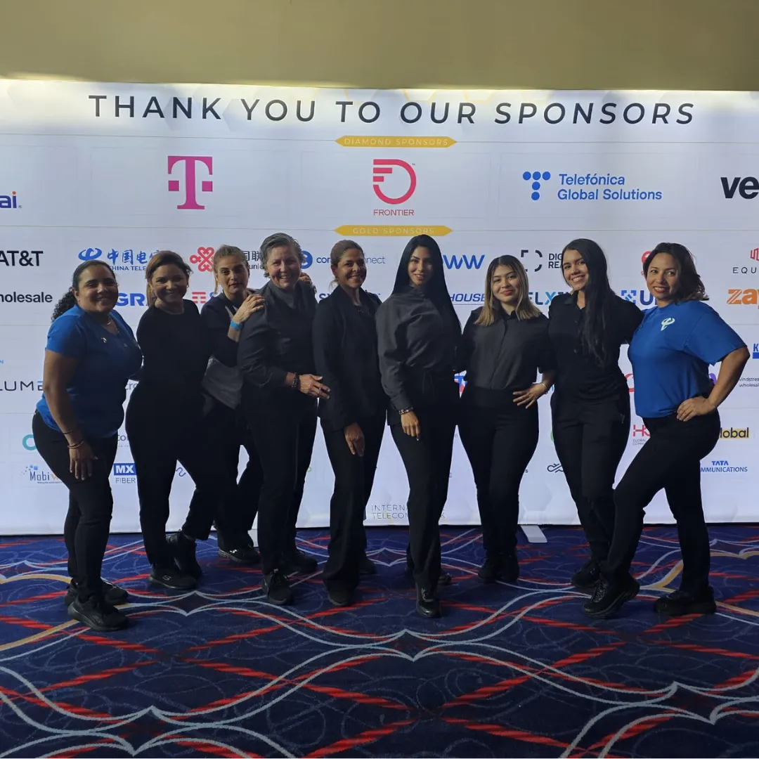 Espresso Events team at a sponsor wall